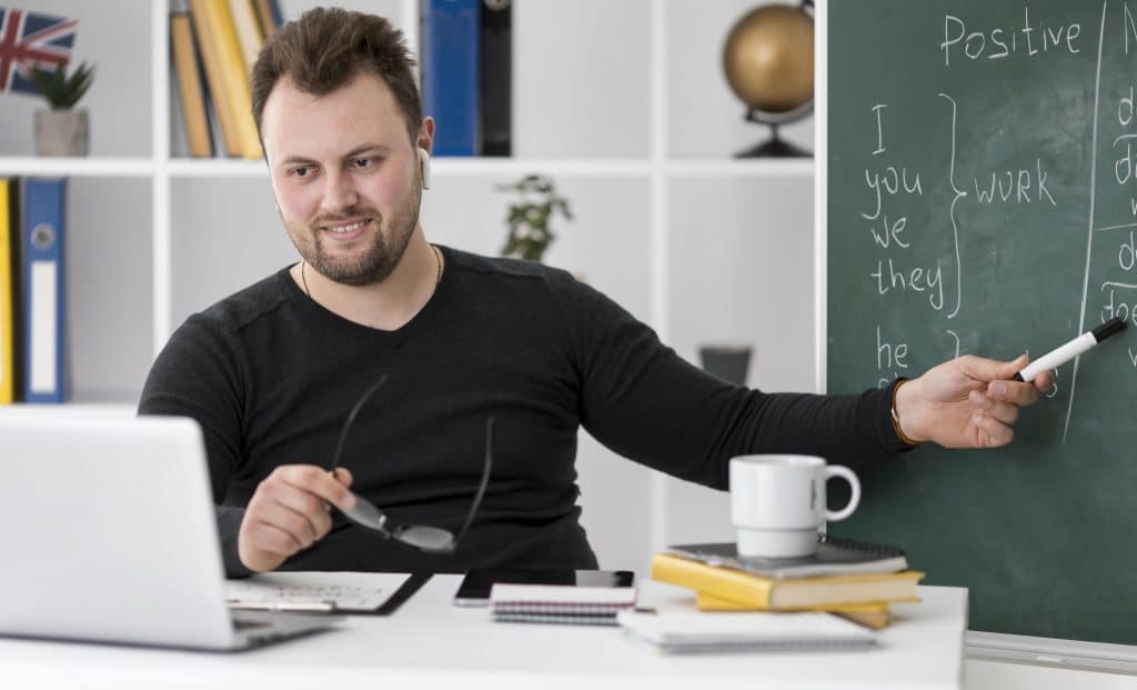 school teacher on a computer